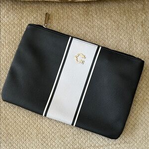 C. Wonder Black & White Striped Zip Pouch with Gold Logo